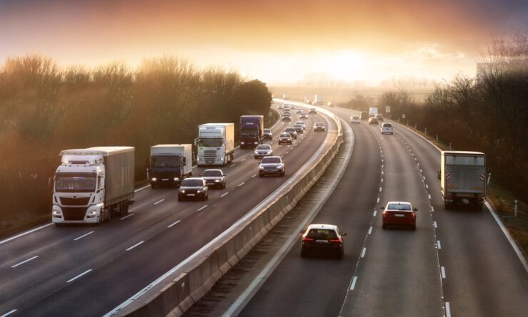 Essential Safety Tips When Your Vehicle Breaks Down on the Highway 3 truck on a busy highway